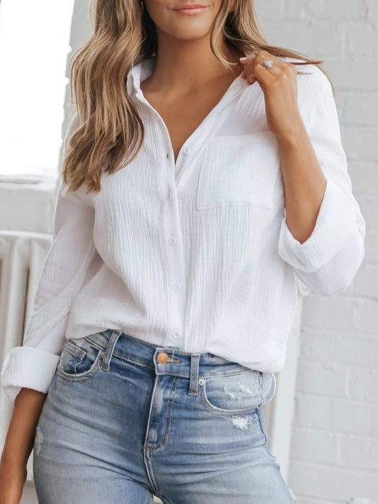 White textured women’s button down shirt styled casually
